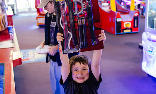 HappylLittle boy with the prize he selected.